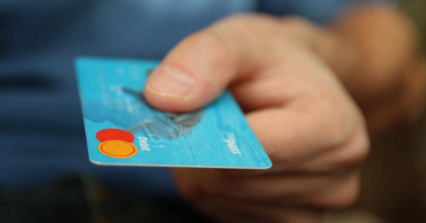 Identity - Person Holding Debit Card