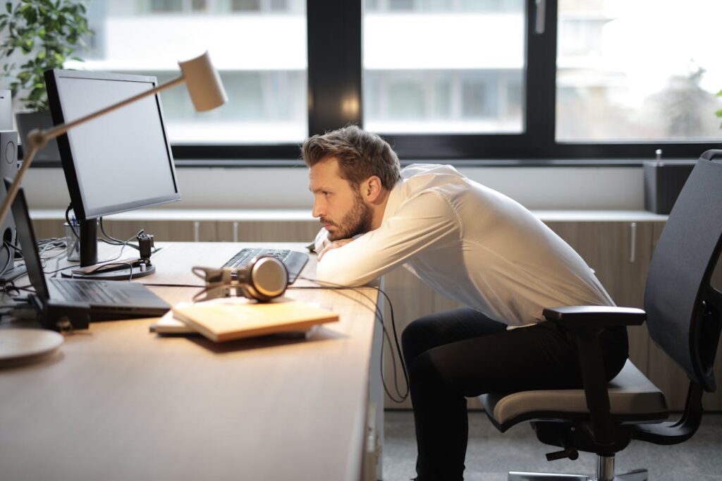 man-in-white-shirt-sitting-on-chair