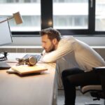 man-in-white-shirt-sitting-on-chair
